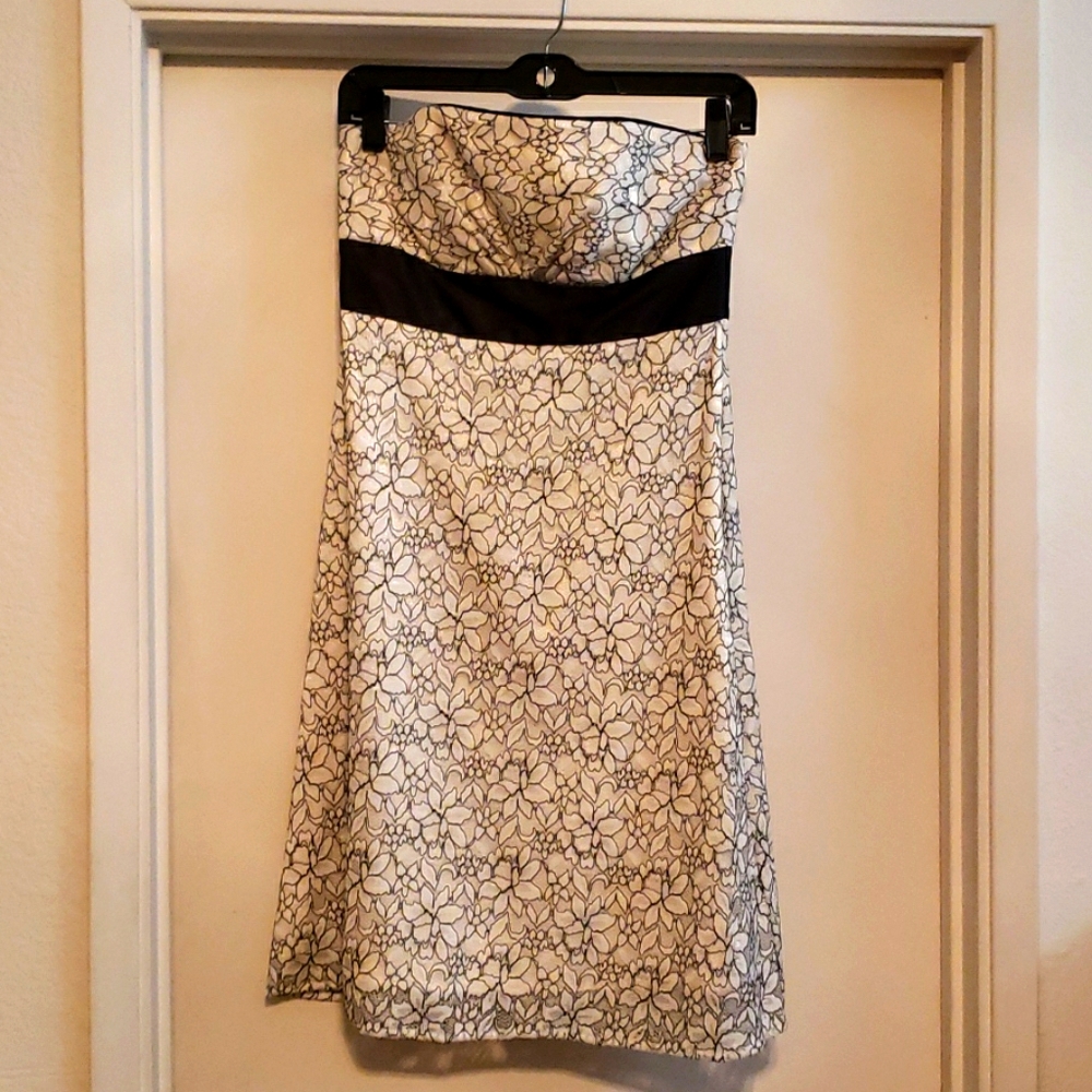 Cream colored statin strapless dress black trim